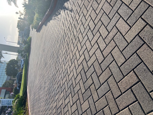 Curved paver driveway by Pave It Landscape LLC