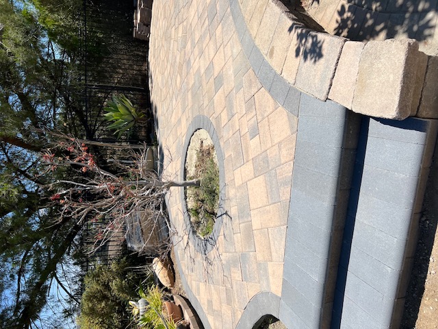Tumbled paver driveway by Pave It Landscape LLC