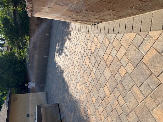 Paver fire pit surround by Pave It Landscape LLC