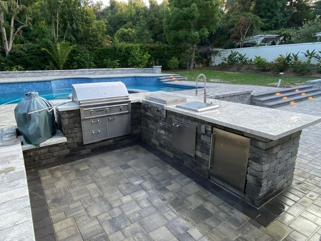 Paver retaining wall and steps by Pave It Landscape LLC