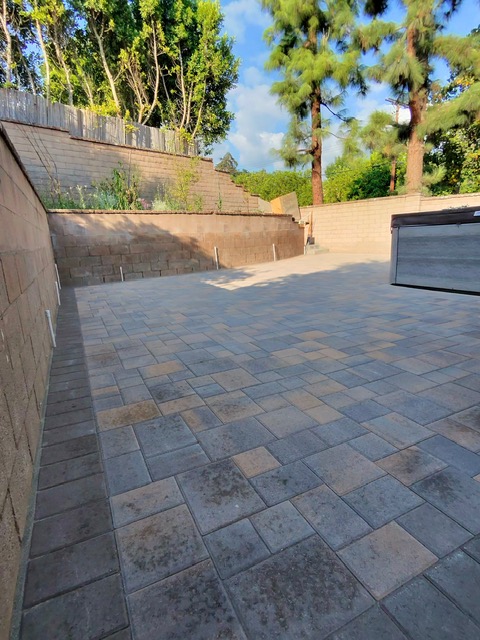 Classic brick paver driveway by Pave It Landscape LLC