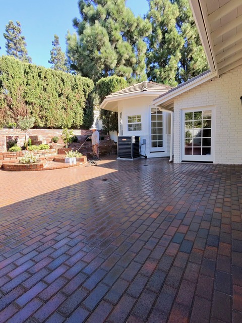 Paver spa surround by Pave It Landscape LLC