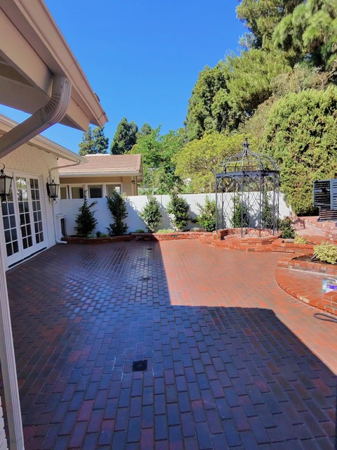 Geometric paver patio design by Pave It Landscape LLC