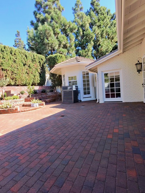 Paver driveway with inlay by Pave It Landscape LLC